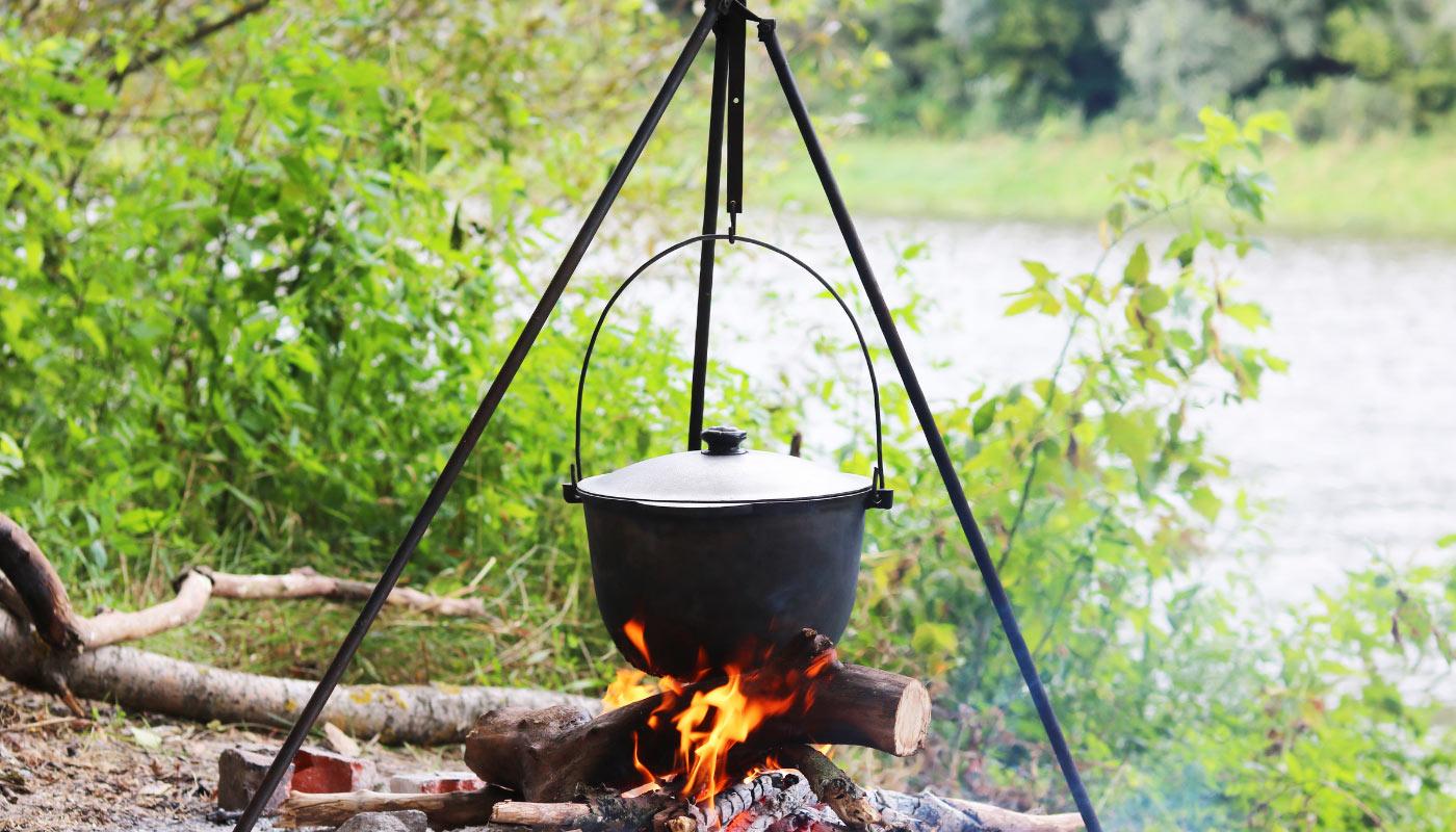 Outdoor cooking scene in Romanian nature